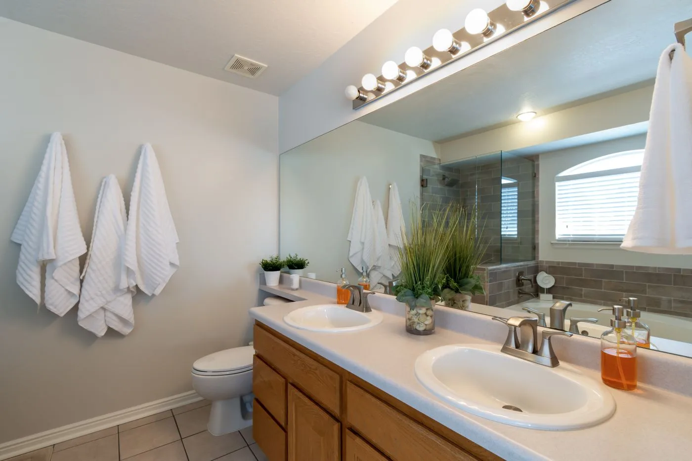 White Towels Hanging Inside a Bathroom