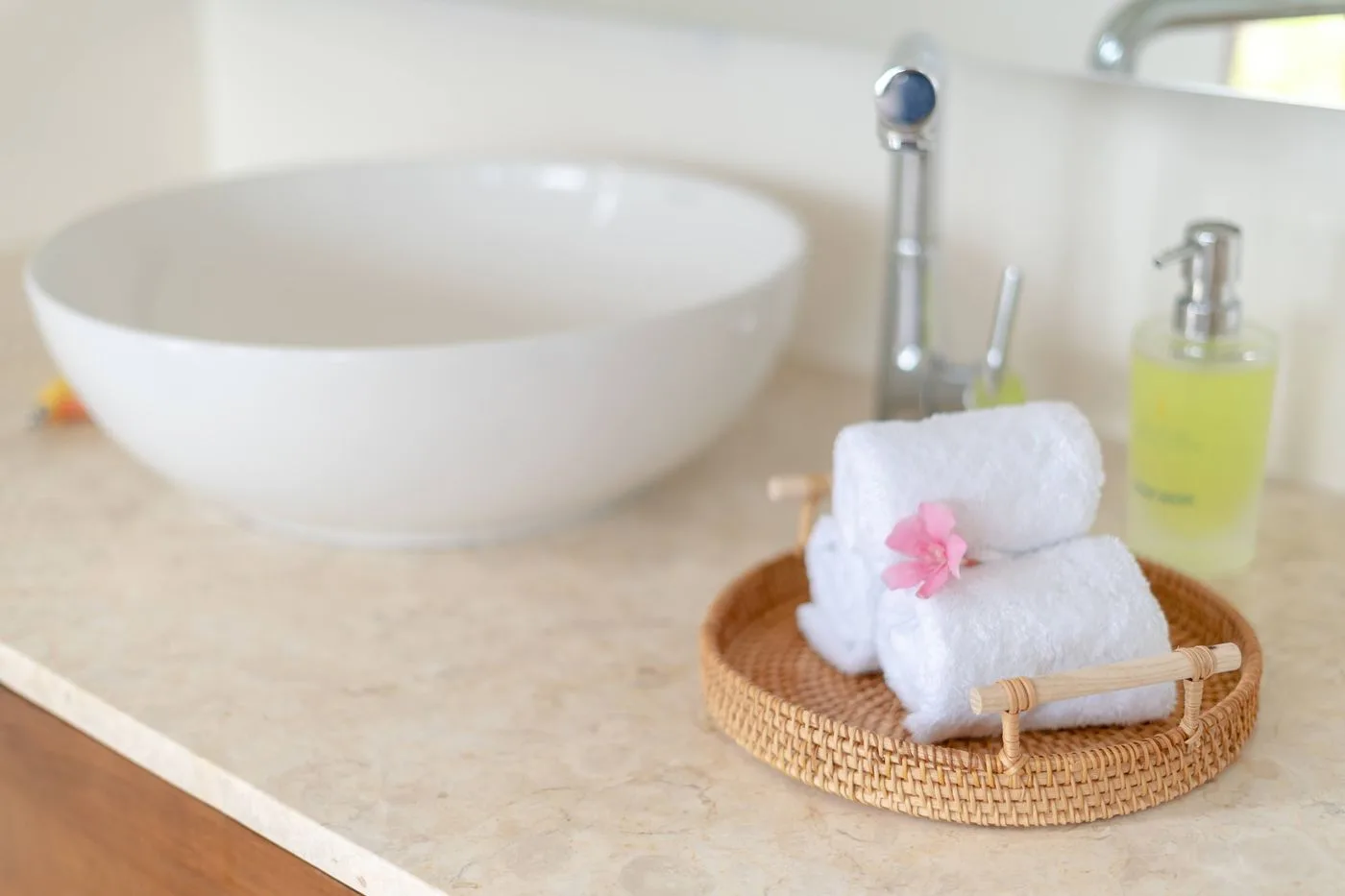 Spa Bathroom with Rolled Towels and Sink
