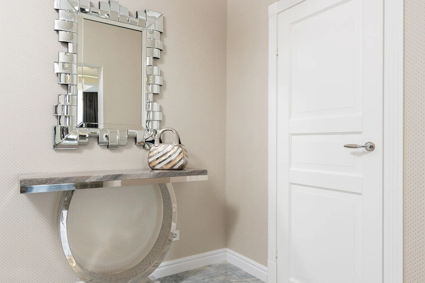 Mirror against entrance door in modern house